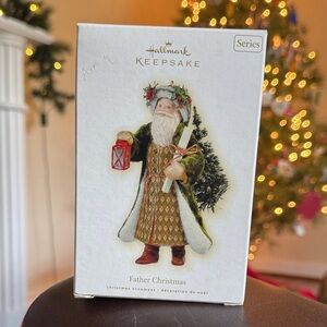 2009 Hallmark Keepsake Father Christmas Ornament - Green and Red